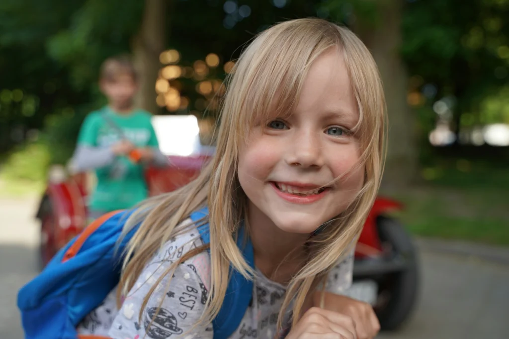 a girl smiling at the camera